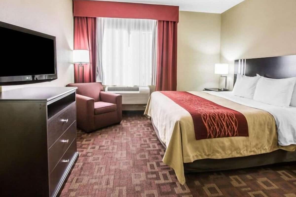 Desk, iron/ironing board, bed sheets, alarm clocks