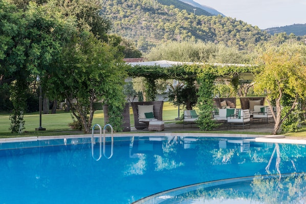 Seasonal outdoor pool, pool umbrellas, pool loungers