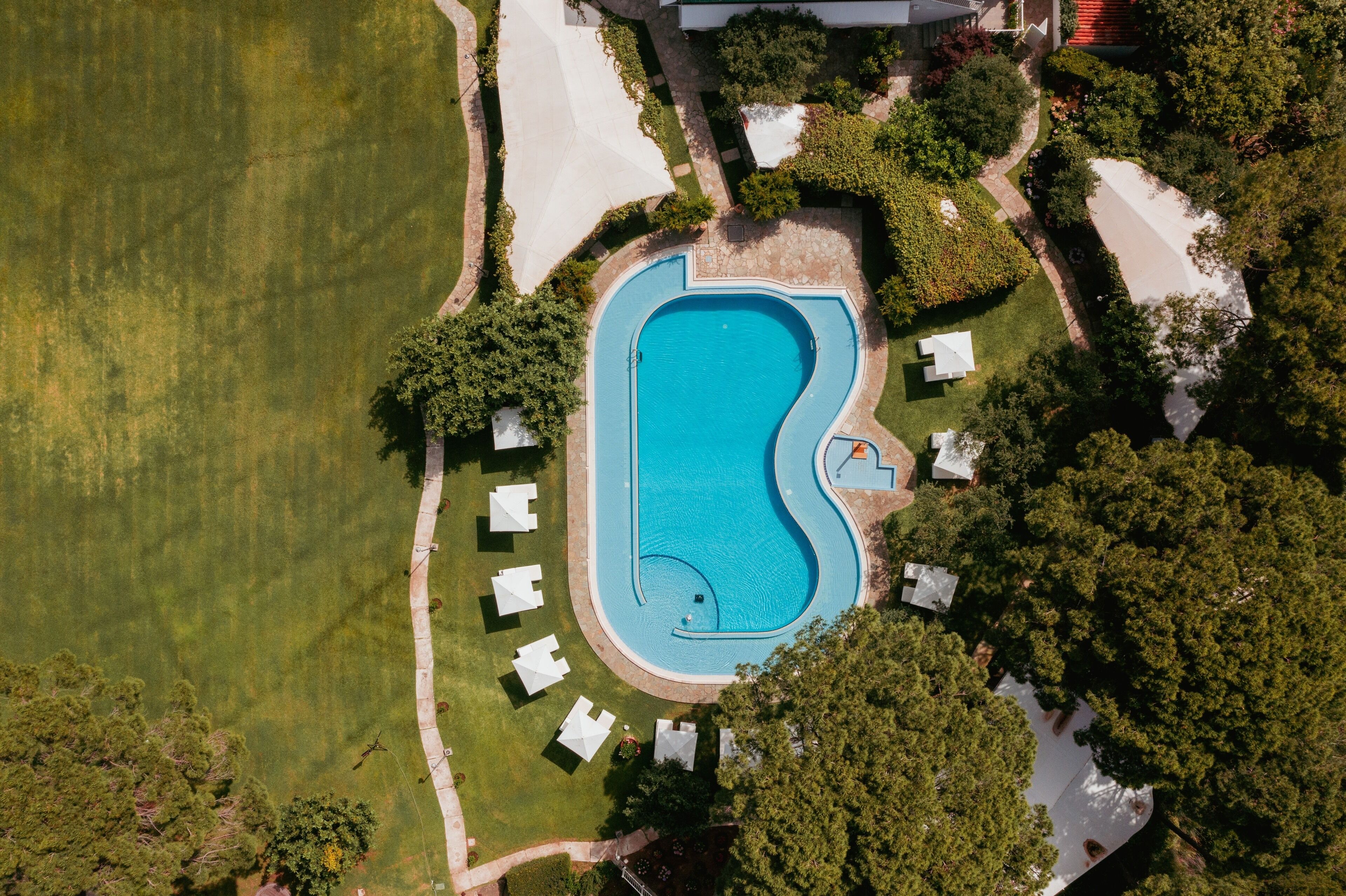 seasonal outdoor pool, pool umbrellas, pool loungers