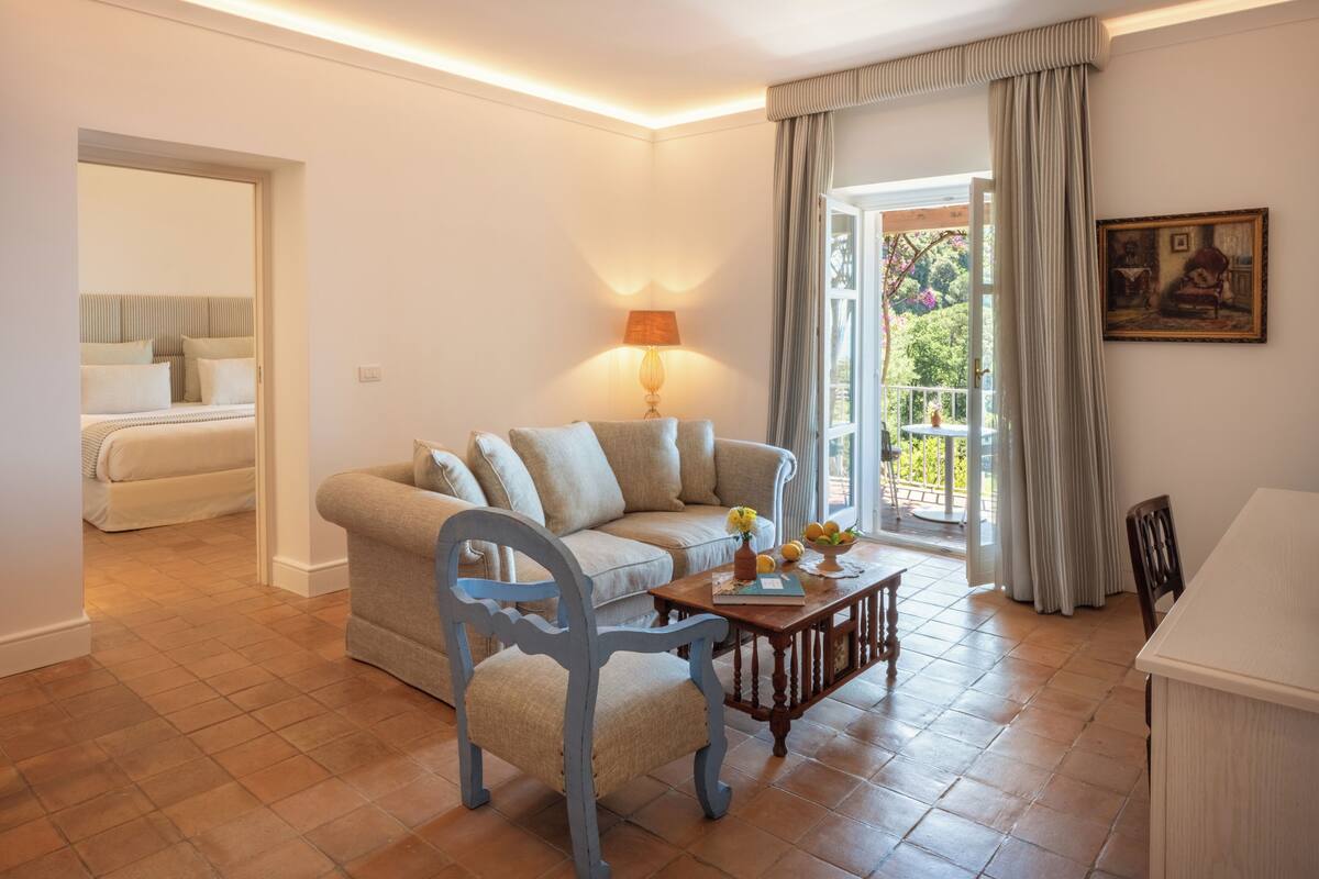Luxury Double or Twin Room | Living area | TV