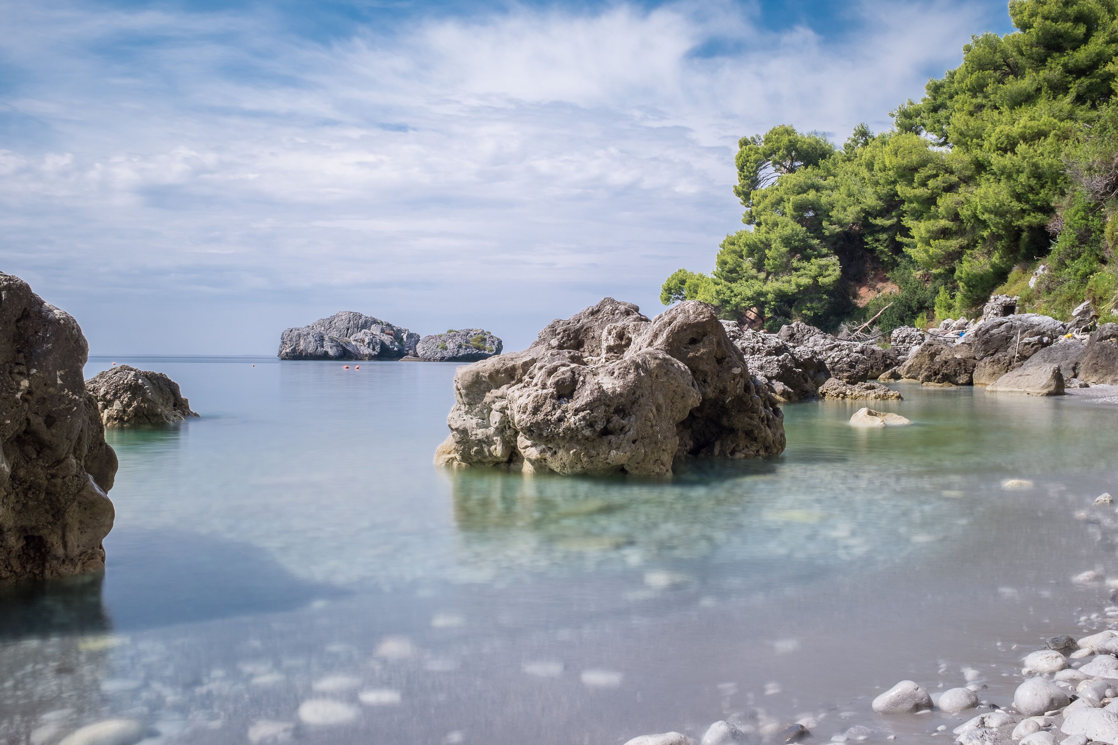 private beach, black sand, free beach shuttle, sun-loungers