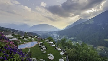 Indoor pool, outdoor pool, pool umbrellas, pool loungers