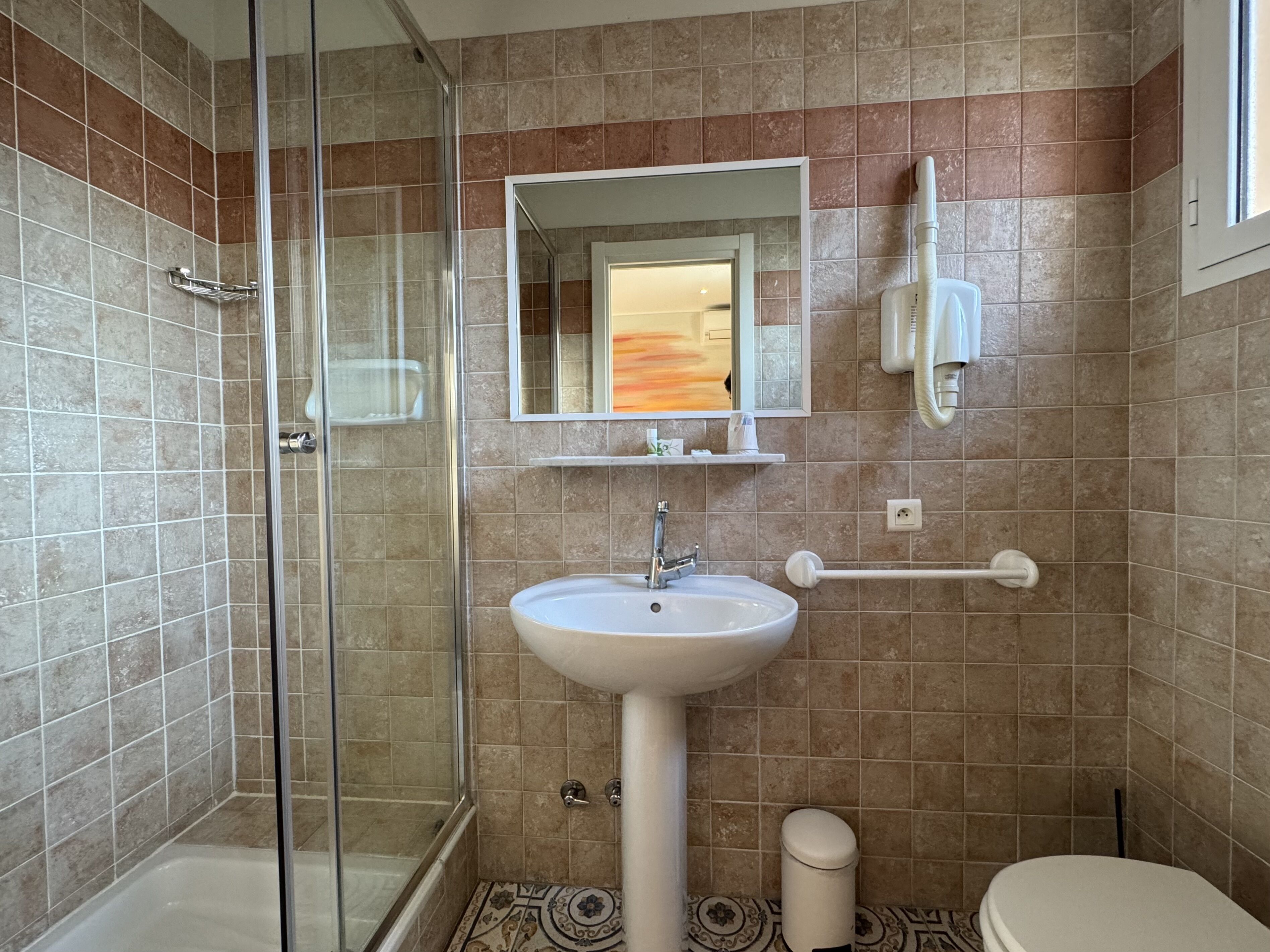 triple room painted wall view | bathroom | shower, hair dryer, towels