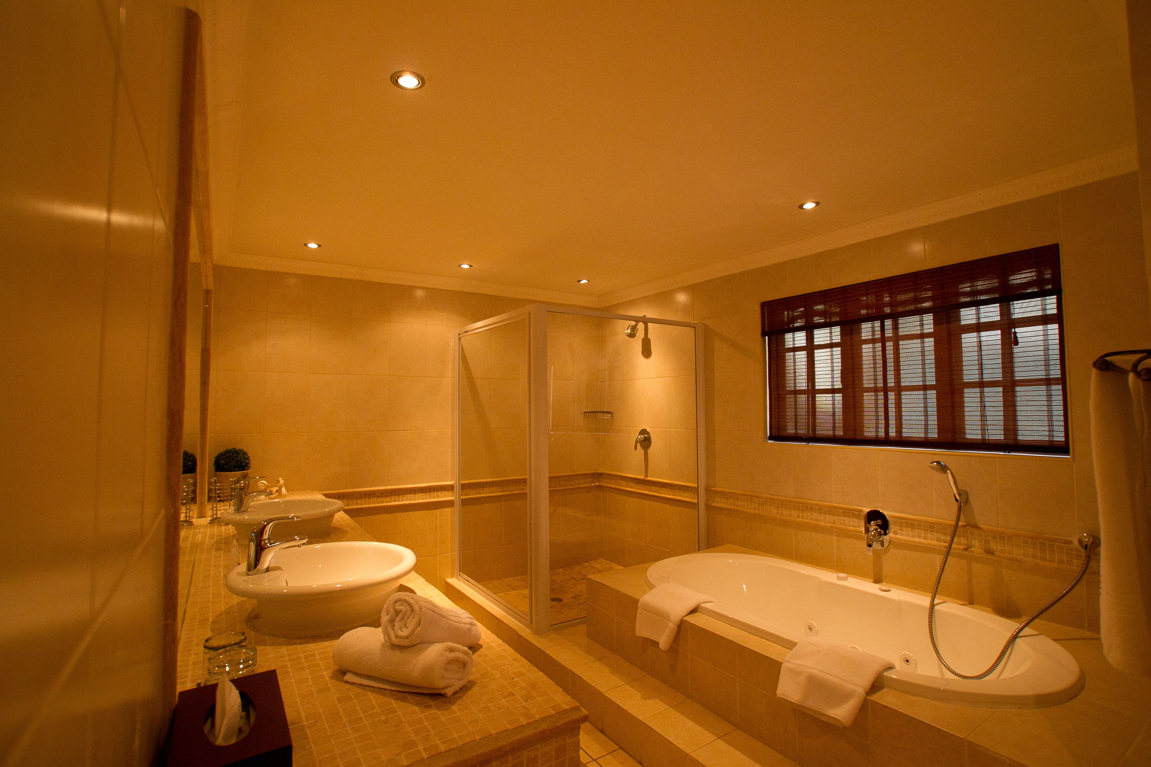 suite, 1 king bed | bathroom | free toiletries, towels