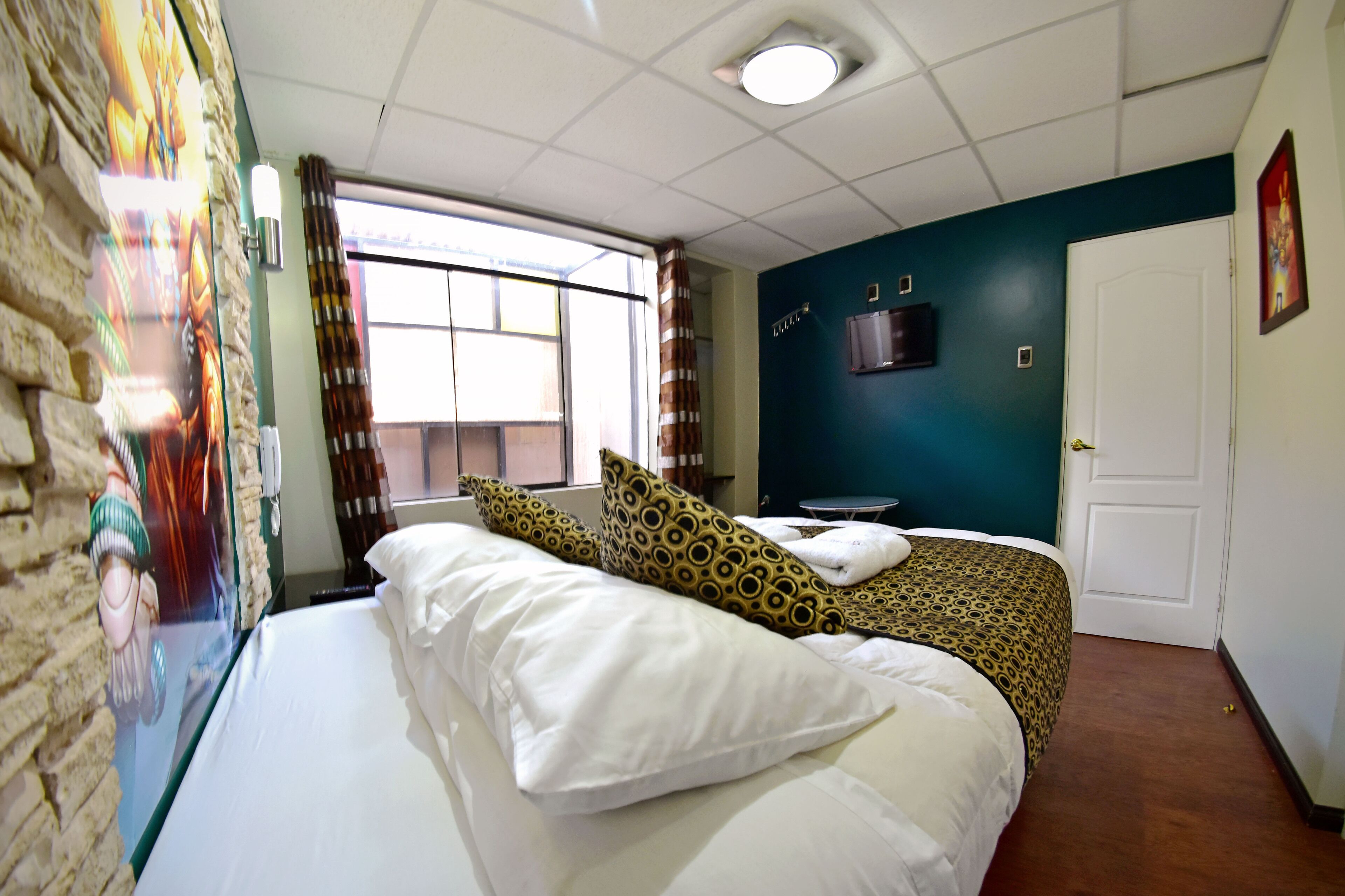 double room | 1 bedroom, in-room safe, individually decorated, desk