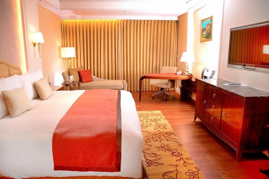 Luxe beddengoed, donsdekens, pillowtop-bedden, een minibar