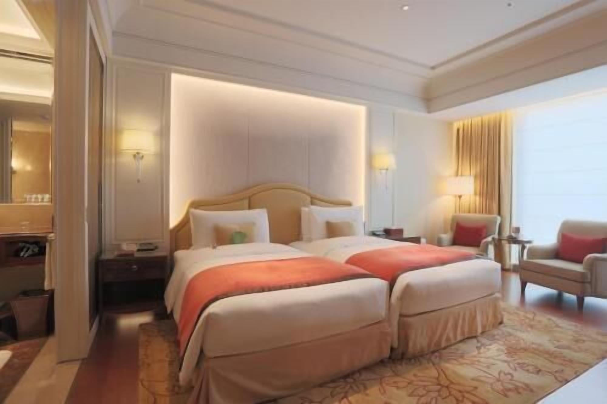 Luxe beddengoed, donsdekens, pillowtop-bedden, een minibar