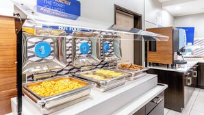 A buffet setup with multiple food dispensers and a coffee machine. - Holiday Inn Express Hotel & Suites Denver North - Thornton by IHG (Thornton)