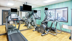 A gym with treadmills, ellipticals, and a mirrored wall. - Holiday Inn Express Hotel & Suites Denver North - Thornton by IHG (Thornton)