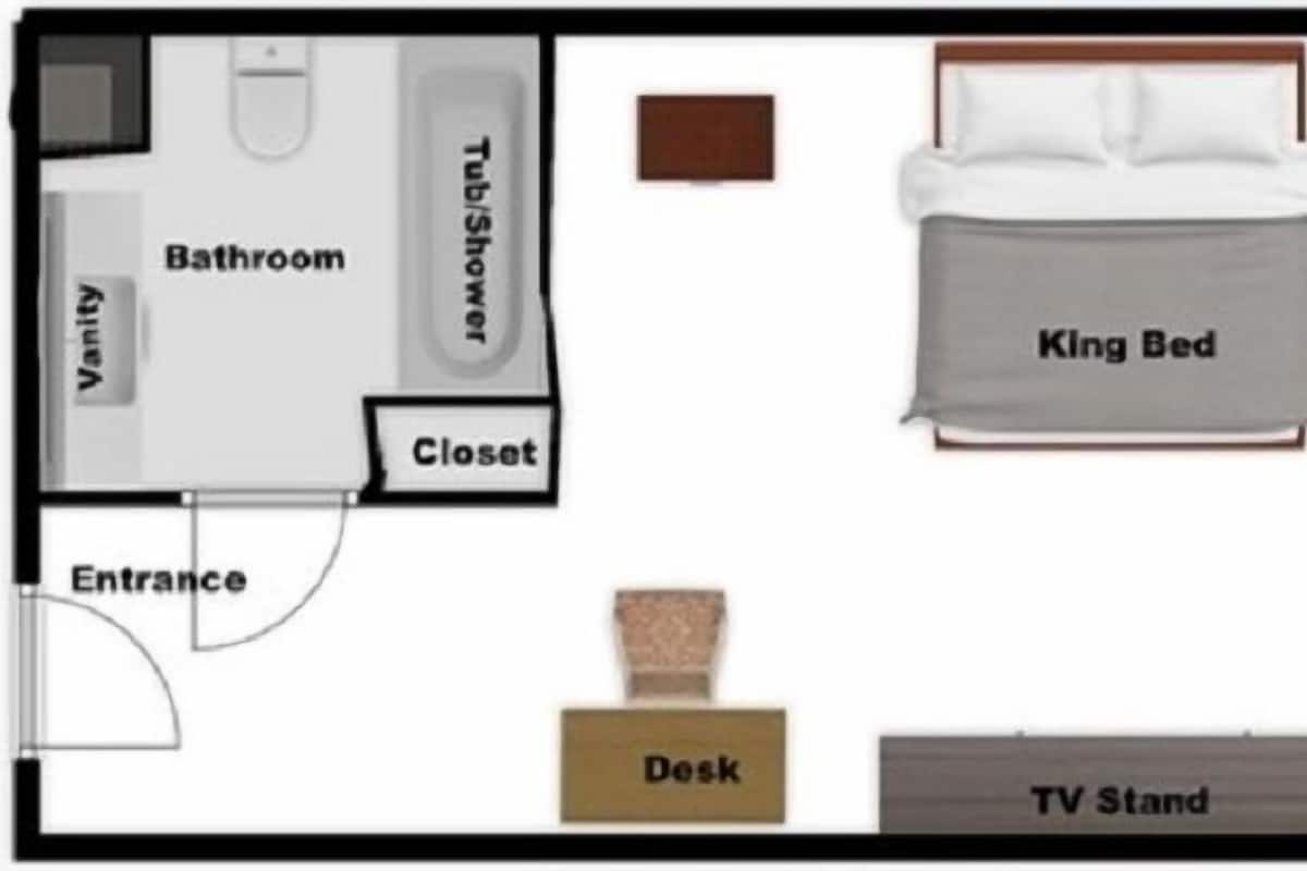 Layout de quarto com cama de casal, armário, toucador, banheiro e entrada.