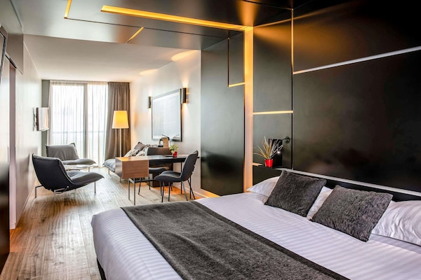 Junior Suite, 1 King Bed with Sofa bed | Premium bedding, in-room safe, desk, blackout drapes