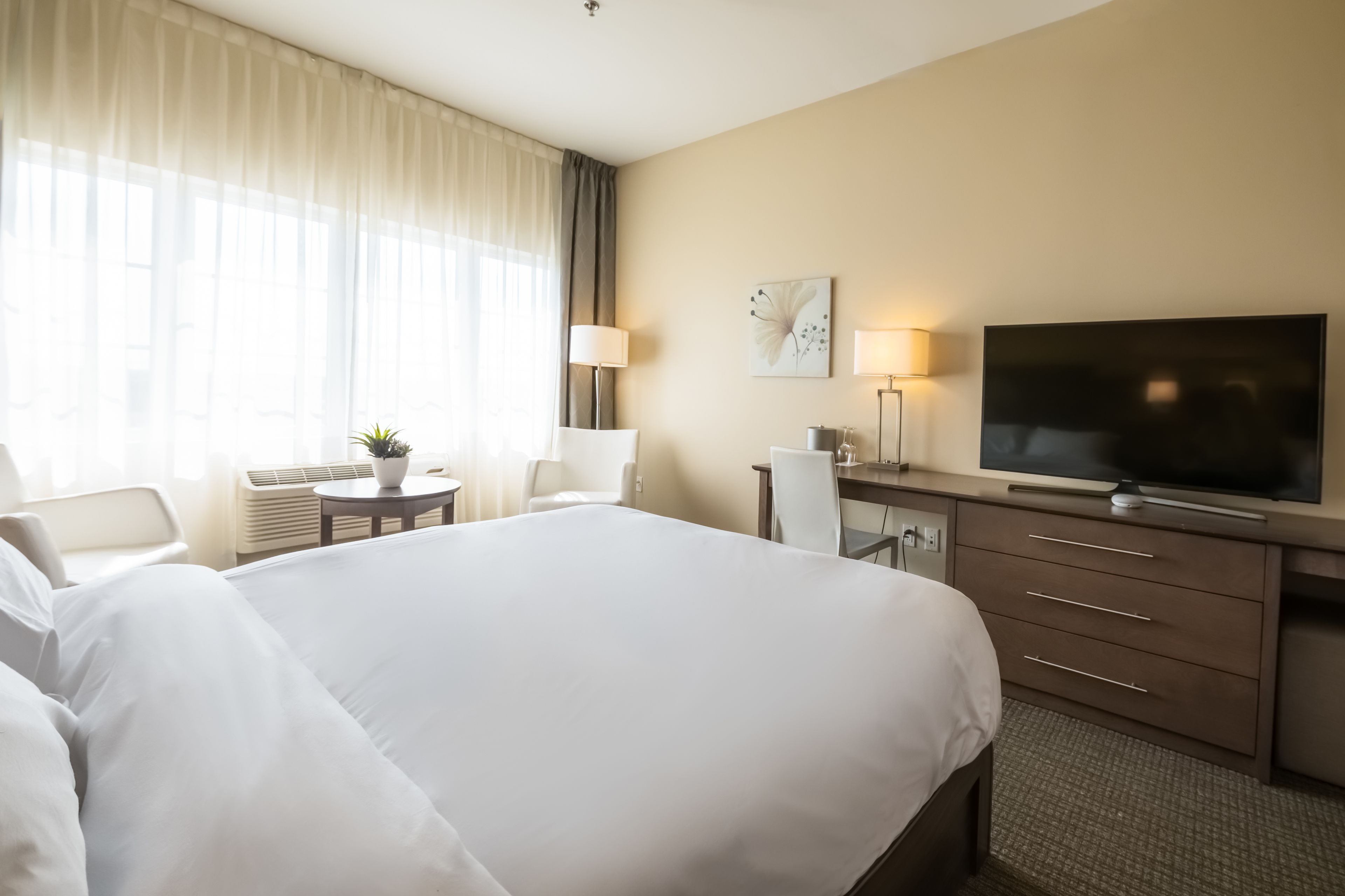 premium bedding, minibar, desk, laptop workspace