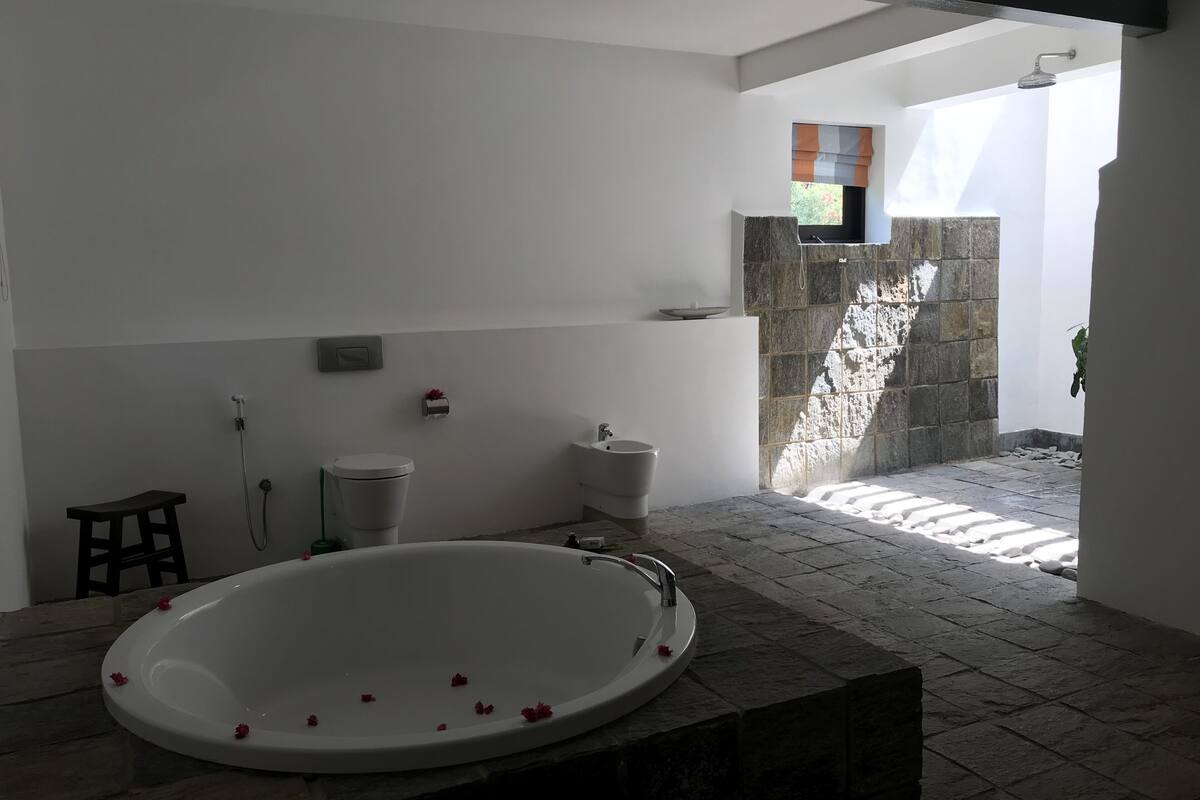 extra large suite | bathroom | separate bathtub and shower, rainfall showerhead, free toiletries