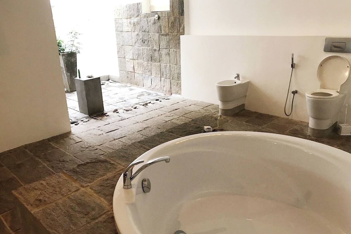 extra large suite | bathroom | separate bathtub and shower, rainfall showerhead, free toiletries