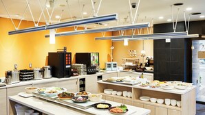 A buffet setup with various food items and serving equipment. - Kobe Sannomiya Union Hotel (Kobe)