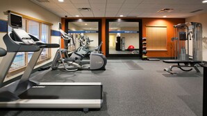 A gym with treadmills, elliptical machines, and weightlifting equipment. - Hampton Inn & Suites Minot Airport (Minot)