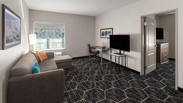 Suite, 1 habitación, para no fumadores (1 King Bed) | Ropa de cama de alta calidad y escritorio