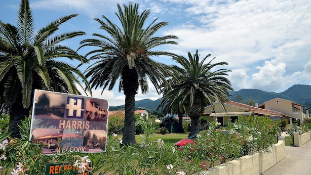 A signboard with "Harris Welcome" and "Reception" indicating a hotel reception area. - Feeloxenia Corfu Apartments (Corfu)