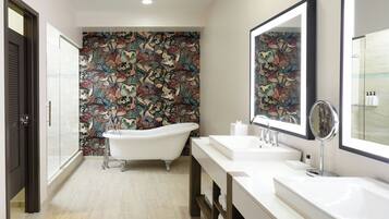 Shower, designer toiletries, hair dryer, towels