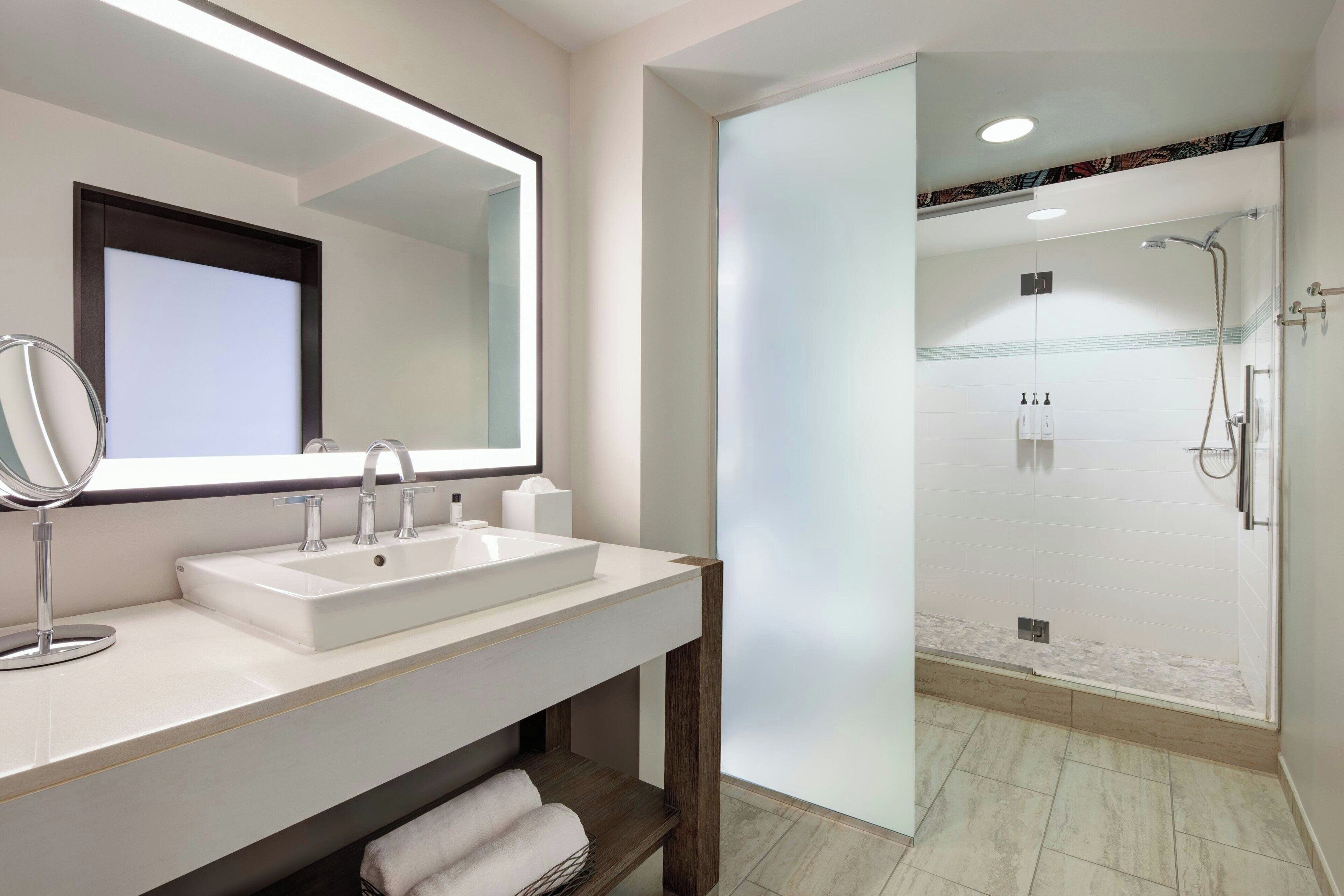 shower, designer toiletries, hair dryer, towels