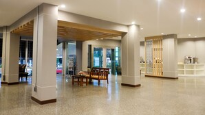 A spacious lobby with a polished floor, wooden furniture, and a seating area. - Krabi Royal Hotel (Krabi)
