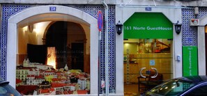 A hotel entrance with a large arched window displaying a cityscape. - 161 Norte Guesthouse (Lisbon)