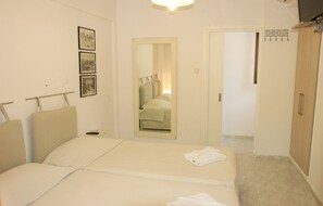 Apartamento família, 2 quartos | Individualmente decorados, Wi-Fi de cortesia, roupa de cama
