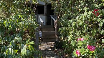 Stroll through lush gardens to the entrance of this serene retreat.