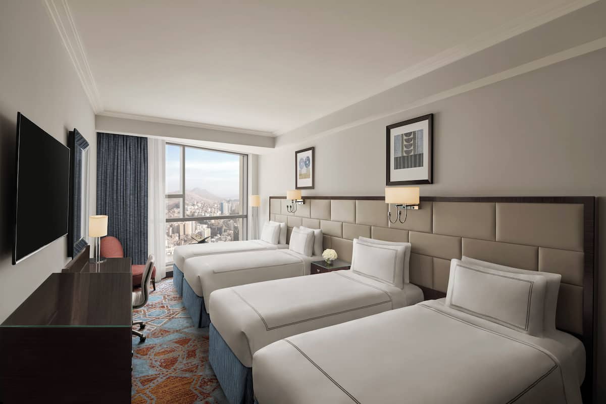 Classic Room (Quad bed, City) | Hypo-allergenic bedding, in-room safe, desk, blackout drapes