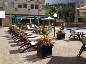 Outdoor pool, a heated pool, open 10:00 AM to 8:00 PM, sun loungers
