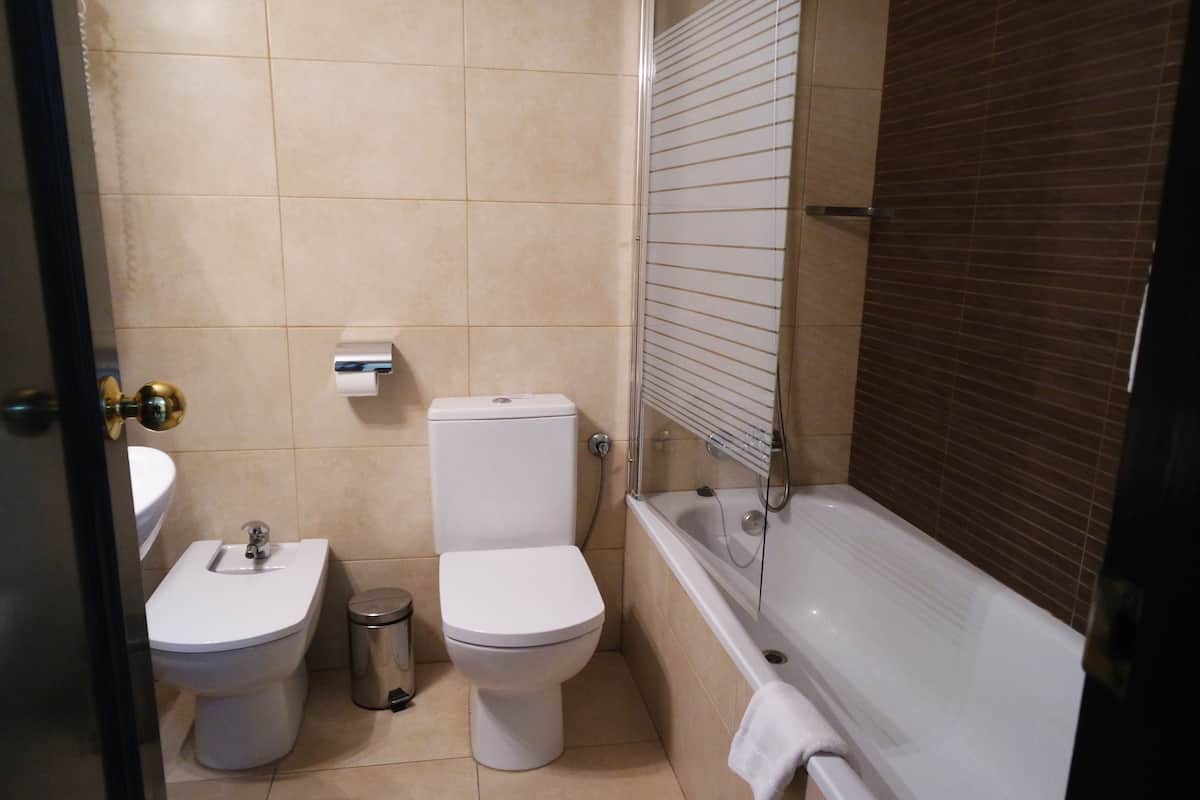 basic twin room, private bathroom | 1 bedroom, down duvets, desk, blackout curtains