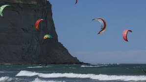 A coastal scene with cliffs and the ocean.