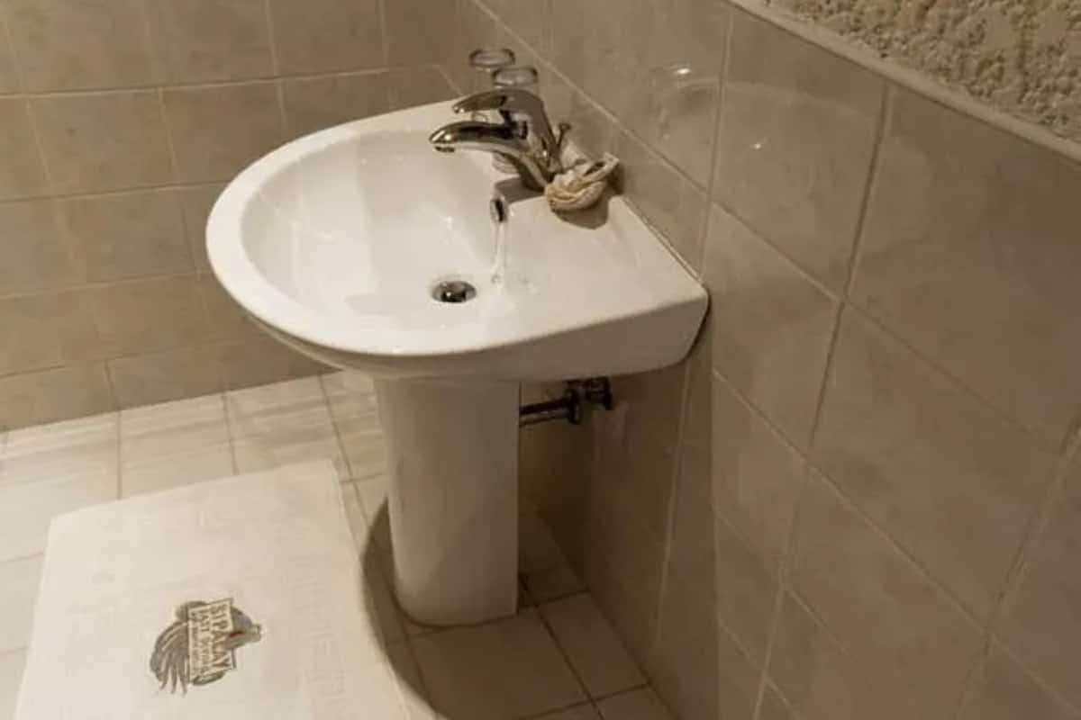 standard bungalow with fan | bathroom | shower, hair dryer, towels, soap