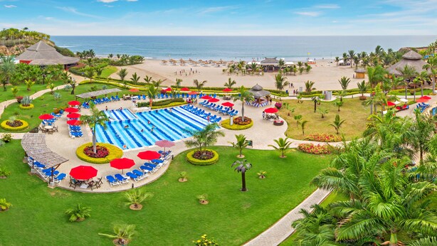A resort with a large pool, beach access, and tropical landscaping. - Royal Decameron Punta Centinela (Santa Elena)