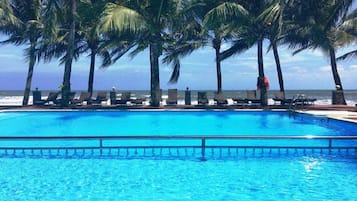 Outdoor pool, open 7:00 AM to 8:00 PM, pool loungers