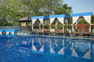 Outdoor pool, free cabanas, pool umbrellas