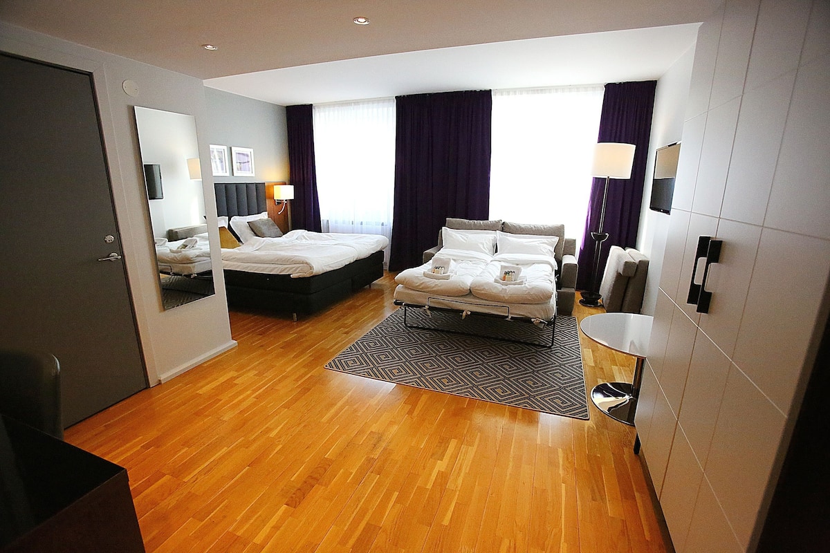 family double room | minibar, in-room safe, desk, blackout curtains