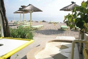 Private beach, sun-loungers, beach umbrellas, beach bar