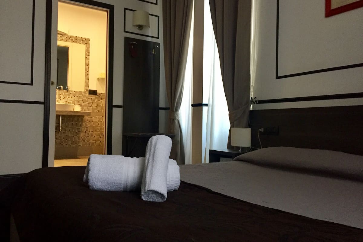 Double Room | Minibar, in-room safe, desk, blackout drapes