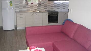 Apartment, 1 Bedroom | Living area | TV