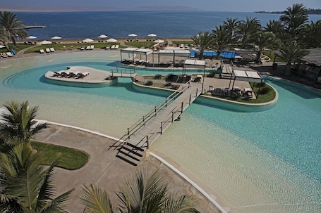 2 outdoor pools, open 9 AM to 9 PM, pool umbrellas, sun loungers. La Hacienda Bahia Paracas