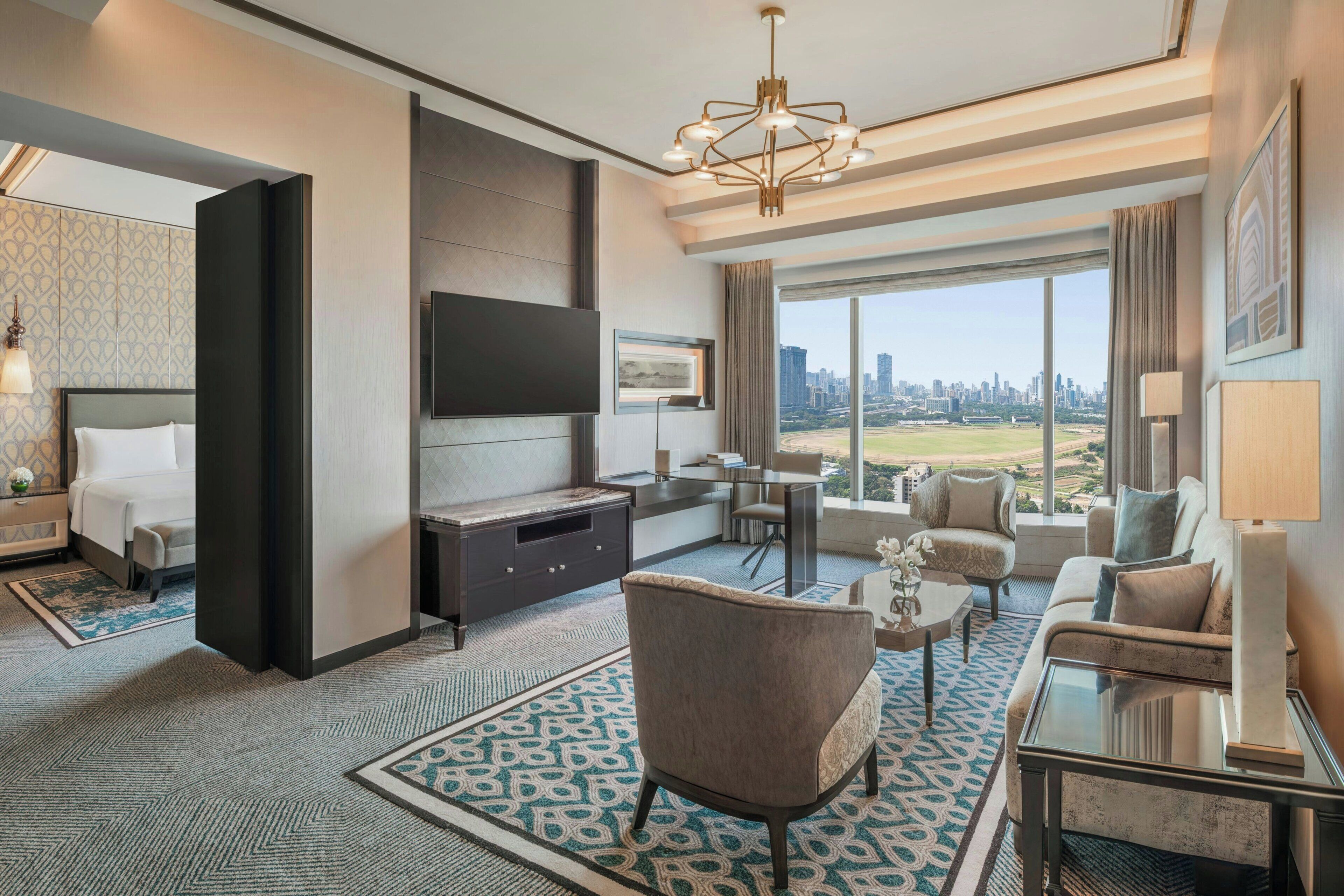 Suite, 1 King Bed | Living room | 42-inch LED TV with satellite channels, TV, DVD player