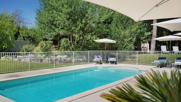 Seasonal outdoor pool, open 8:00 AM to 8:00 PM, pool umbrellas