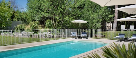 Seasonal outdoor pool, open 8:00 AM to 8:00 PM, pool umbrellas