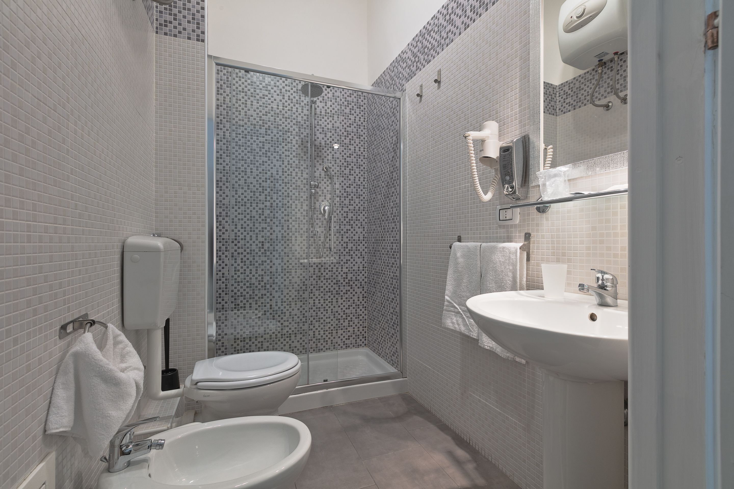 Triple Room, Balcony | Bathroom | Shower, rainfall showerhead, free toiletries, hair dryer