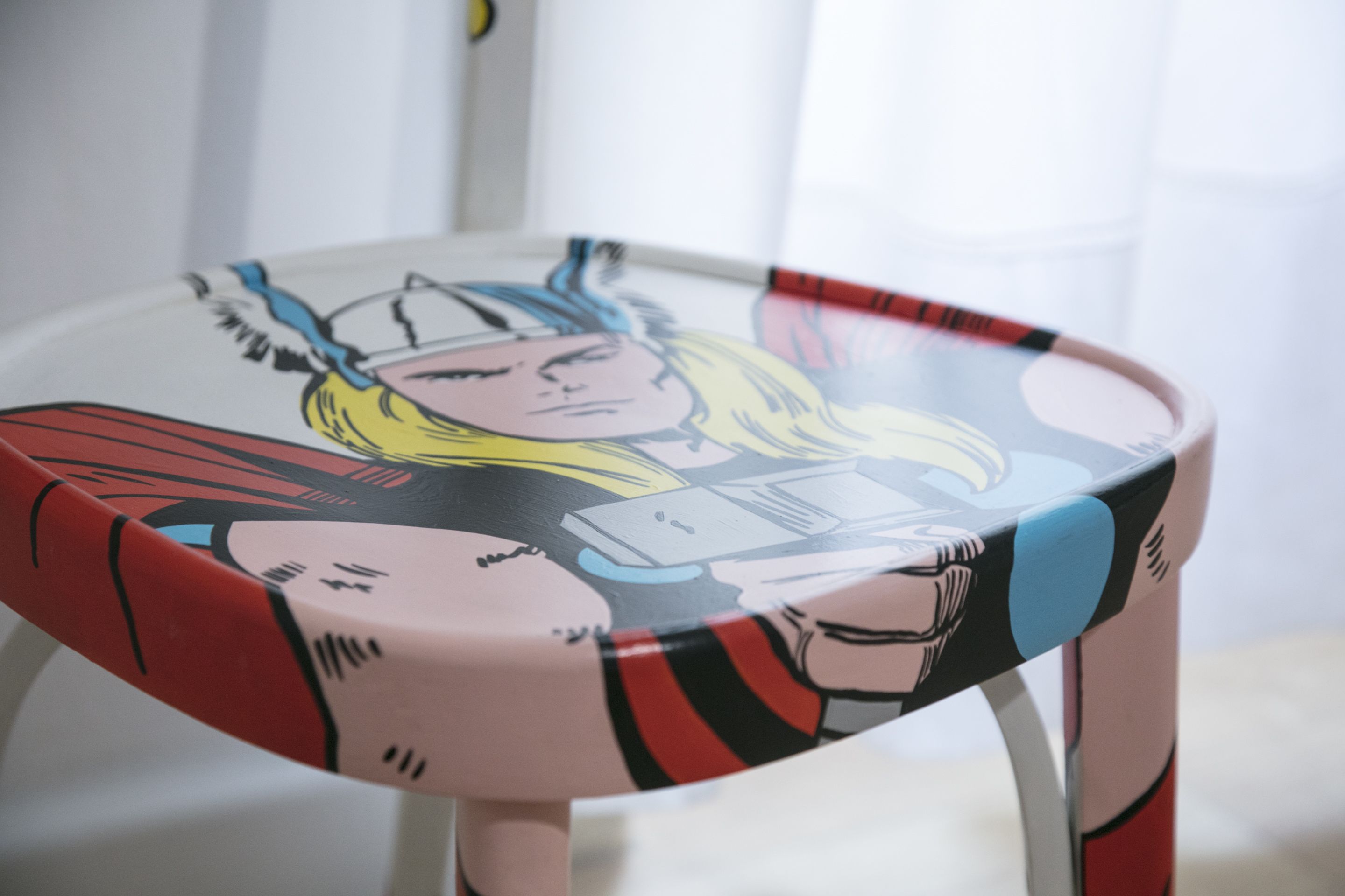 A chair with a graphic design featuring a character.