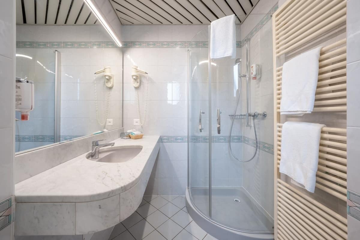 minibar, desk, blackout curtains, iron/ironing board