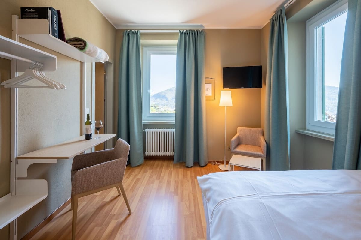 Minibar, desk, blackout curtains, iron/ironing board