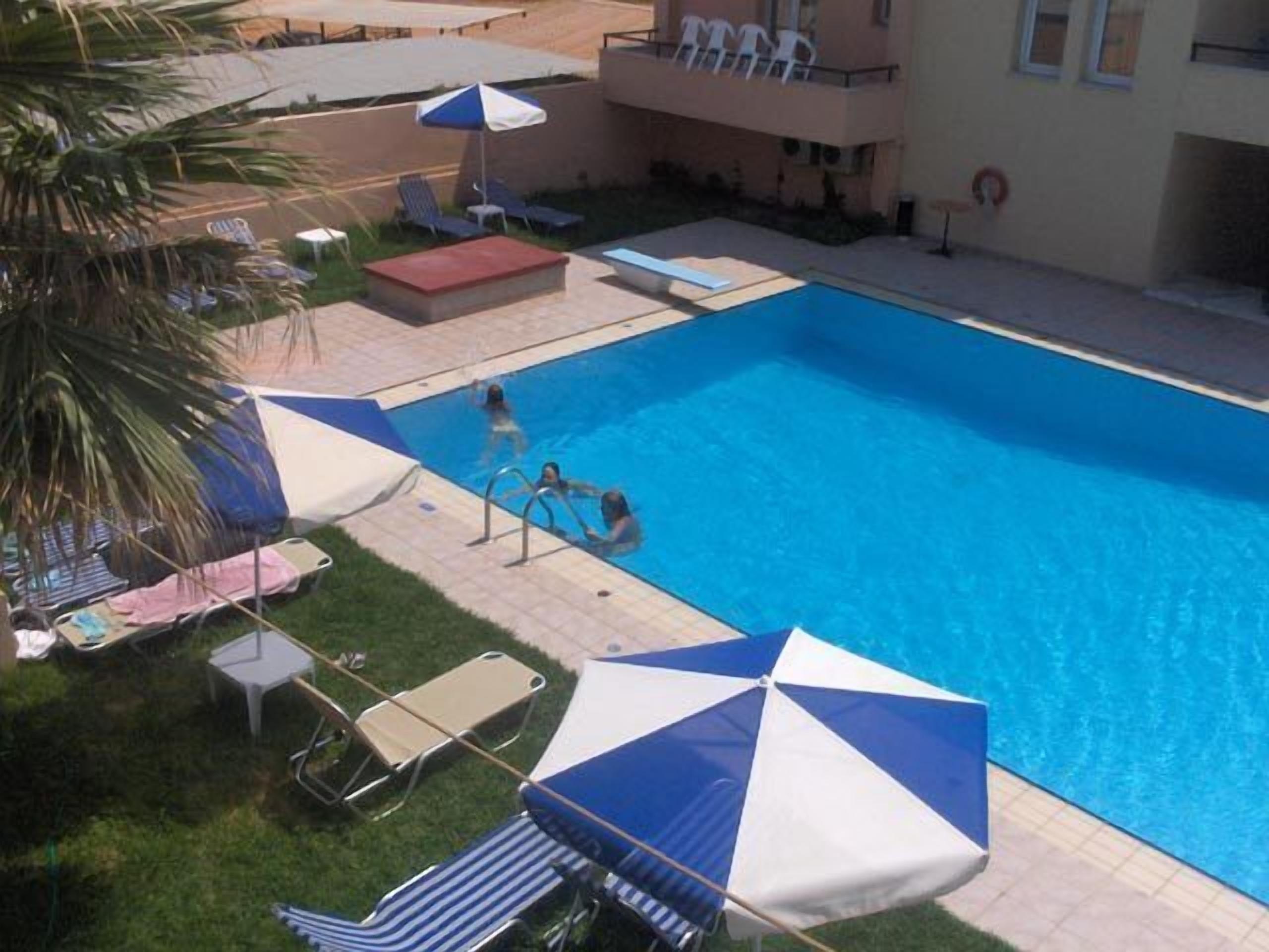 outdoor pool, pool umbrellas, pool loungers