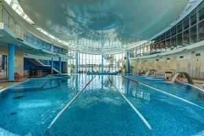 Indoor pool, outdoor pool, pool umbrellas, pool loungers